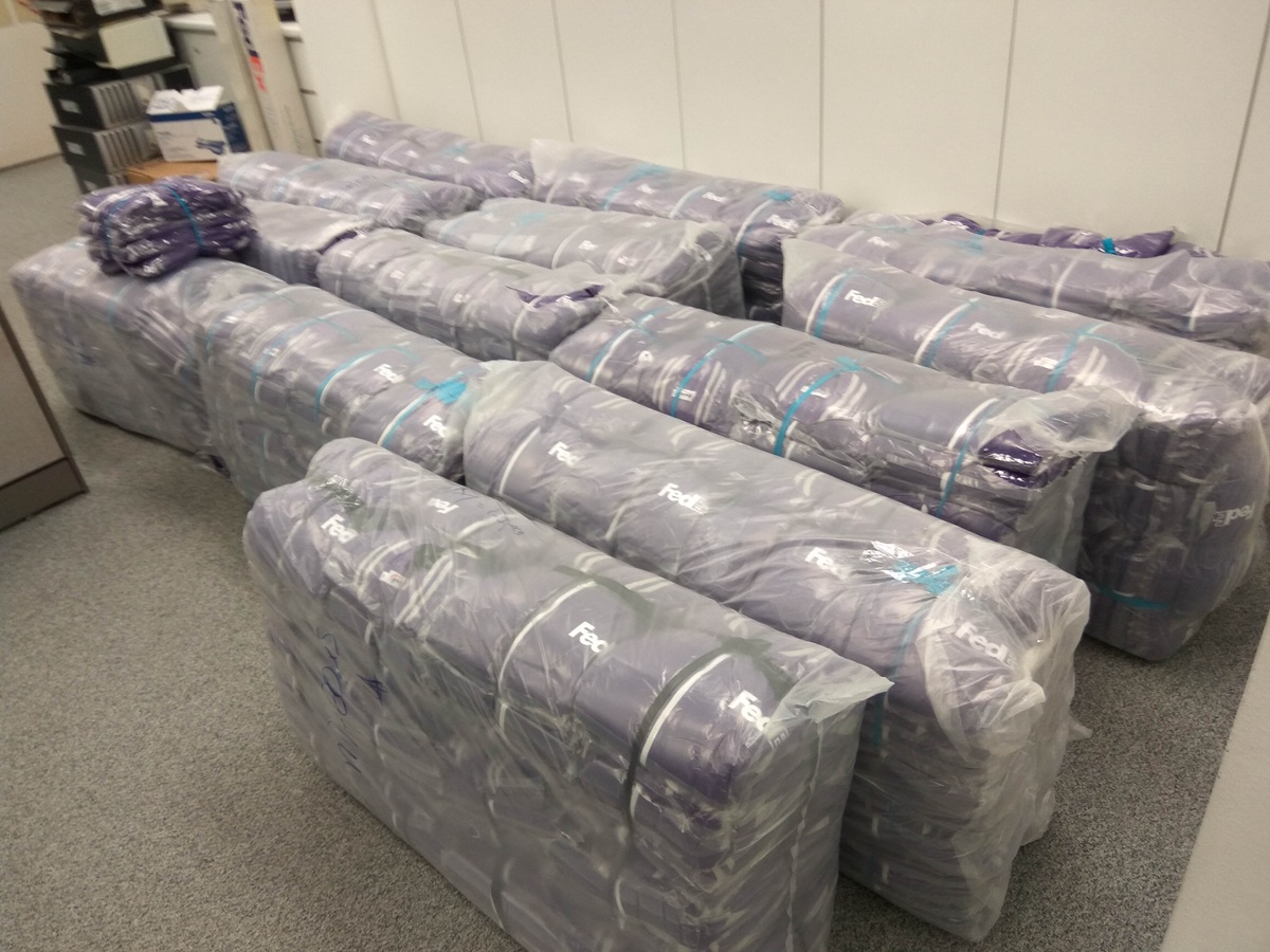 Bulk custom jackets packed and ready for delivery