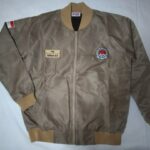 Beige corporate bomber jacket with embroidered organisation patches on the chest