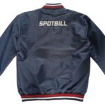 Back view of navy blue bomber jacket with white SPOTBILL lettering