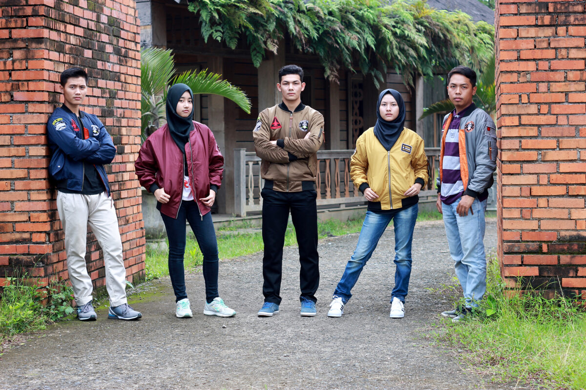 Custom Bomber Jackets in Different Colours Group wearing custom bomber jackets in different colours