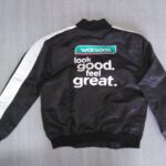 Black and white custom bomber jacket with Watsons branding printed on the back