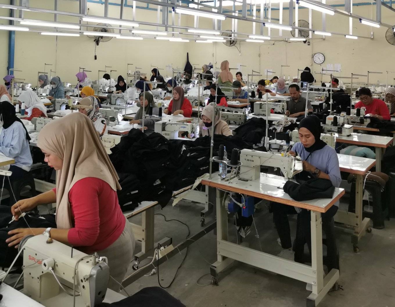 Custom jacket sewing production in garment factory
